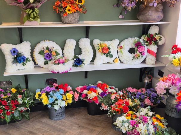 Artificial flowers showing various arrangements